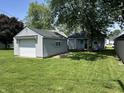 View of the backyard features a detached garage for parking or storage space at 420 S Oak St, Fortville, IN 46040