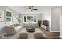 Bright living room featuring hardwood floors, modern furniture and large window at 4255 N County Road 1025 E, Indianapolis, IN 46234