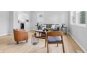 Stylish living room with modern decor, including a sleek couch, chairs, and contemporary furnishings at 450 N Fenton Ave, Indianapolis, IN 46219