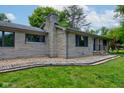 Beautiful home exterior featuring stone facade and landscaped walkway at 4853 E 65Th St, Indianapolis, IN 46220