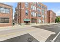 Exterior view showing the building facade and street at 630 N College Ave # 204, Indianapolis, IN 46204