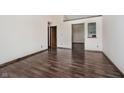 Spacious and bright living room with wood-look flooring at 7418 Southern Lakes Dr, Indianapolis, IN 46237