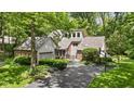 Charming home with well-kept lawn, brick accents, and a paved driveway in a tranquil setting at 7426 Shadow Wood Dr, Indianapolis, IN 46254