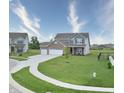 Attractive two-story home with brick accents and a two-car garage in a well-maintained suburban neighborhood at 925 Bent Branch Cir, Greenwood, IN 46143