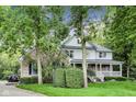 Beautiful two-story home featuring a combination of brick and siding, surrounded by lush trees and landscaping at 9698 Coyote Ct, Noblesville, IN 46060