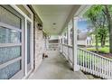 Spacious front porch with white railings, brick detailing, and a modern front door, perfect for outdoor enjoyment at 9698 Coyote Ct, Noblesville, IN 46060