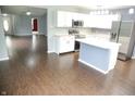 Modern kitchen with white cabinets, stainless steel appliances, and a central island, perfect for Gathering gatherings at 10112 Split Rock Way, Brownsburg, IN 46112