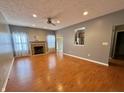 Spacious living room with fireplace, recessed lighting, and wood flooring at 10725 Tedder Lake Dr, Indianapolis, IN 46239