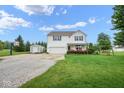 Beautiful front yard with a well-maintained lawn, shed, basketball hoop, and inviting landscaping at 11198 N 650 W, Fountaintown, IN 46130