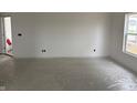 Bright room featuring white walls, a window, and a plastic-covered floor at 1441 Elm St, Martinsville, IN 46151