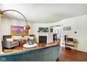 Bright living room with hardwood floors, fireplace, stylish furniture, and modern decor at 1548 N Park Ave, Indianapolis, IN 46202