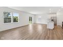 Spacious living area with light wood floors, large windows, and bright natural light at 1669 Windrush Pl, Westfield, IN 46074