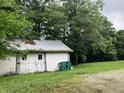 Exterior of a white barn with garbage cans at 18229 Moontown Rd, Noblesville, IN 46062