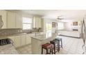 Bright kitchen with granite countertops, an island, and modern appliances at 2096 Whitetail Ct, Avon, IN 46123