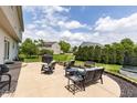 Spacious backyard patio with comfortable seating and a view of the lush lawn at 2096 Whitetail Ct, Avon, IN 46123