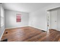 Bright living room featuring gleaming hardwood floors and fresh paint at 2164 E Raymond St, Indianapolis, IN 46203