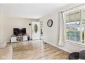 Inviting living room with a large window, hardwood floors, and modern decor at 2405 E 9Th St, Anderson, IN 46012