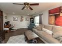Spacious living room with wood flooring, ceiling fan, and comfortable furnishings at 2782 Branigin Creek Blvd, Franklin, IN 46131