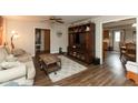 Inviting living room with wood flooring, ample seating, and an entertainment center at 2782 Branigin Creek Blvd, Franklin, IN 46131