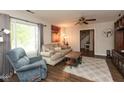 Comfortable living room with wood floors, ceiling fan and neutral tones throughout at 2782 Branigin Creek Blvd, Franklin, IN 46131