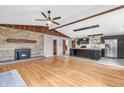 Open concept with hardwood floors and a stone fireplace in the spacious living area at 3201 Chamberlin Dr, Indianapolis, IN 46227