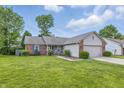 Charming single-story home with a well-manicured lawn and a two-car garage at 34 Westview Pl, Bargersville, IN 46106