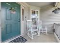 Inviting front porch with rocking chairs, perfect for relaxing outdoors at 34 Westview Pl, Bargersville, IN 46106