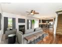 Stylish living room featuring a fireplace, modern decor, and an open layout that connects to the kitchen at 4650 Blue Marlin Way, Indianapolis, IN 46239