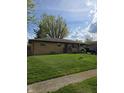 Beautiful single-story home featuring a well-kept lawn and welcoming facade at 6133 Ashway Ct, Indianapolis, IN 46224