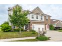 Well-maintained home with a manicured lawn and a two-car garage at 6296 Sugar Maple Dr, Zionsville, IN 46077