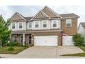 Attractive two-story home with brick and siding, featuring a double garage at 6296 Sugar Maple Dr, Zionsville, IN 46077