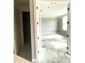 Bright bedroom featuring neutral paint, white trim, and natural light at 7317 Bayview Run, McCordsville, IN 46055