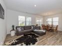 Spacious living room with a cozy sofa that connects to a dining area at 794 Harley Ln, Westfield, IN 46074