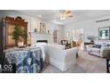 Spacious living area with fireplace, sofa, and plenty of natural light at 9973 Woods Edge Dr, Fishers, IN 46037