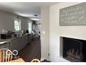 Open kitchen view with grey cabinets, granite counters, stainless appliances, and adjacent dining area at 101 E Hill Valley E Dr, Indianapolis, IN 46227