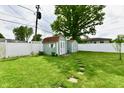 Large, well-maintained shed with a double door, perfect for storage at 121 Mulberry Dr, Chesterfield, IN 46017
