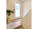 Bright entryway featuring frosted glass door, modern hardware, and elegant plant display at 2125 Coretta Way, Indianapolis, IN 46202