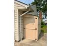 An outdoor storage shed with neutral color complements the home's exterior, useful for storage at 254 Bittersweet Dr, Whiteland, IN 46184