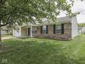 Charming single-story home with a brick facade, manicured lawn, and attached one car garage at 2756 Branigin Creek Blvd, Franklin, IN 46131