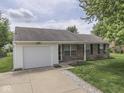 Charming single-story home with a brick facade, manicured lawn, and attached one car garage at 2756 Branigin Creek Blvd, Franklin, IN 46131