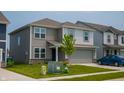 Attractive two-story home with gray siding, a two-car garage, and a lush green lawn at 2916 W Bargello Ln, Monrovia, IN 46157