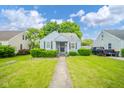 Charming single Gathering home with blue siding, front porch, well maintained lawn, and nice curb appeal at 3004 Sheridan St, Anderson, IN 46016