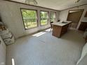 Spacious eat-in kitchen featuring an island with sink, linoleum floors and views of the front yard at 3587 Lower Patton Park Rd, Martinsville, IN 46151