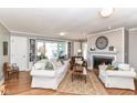 Inviting living room with a fireplace, built-in bookshelves, and natural light, perfect for relaxation at 3840 W 38Th St, Anderson, IN 46011