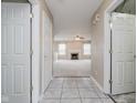 Inviting entryway with tile flooring leading into a spacious living room featuring a cozy fireplace at 5258 Brassie Dr, Indianapolis, IN 46235