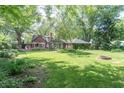 Lush backyard with a fire pit and outdoor seating area for entertaining at 5315 Camden St, Indianapolis, IN 46227