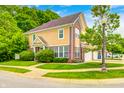 Beautifully landscaped yard surrounds this home, with an attached garage and driveway at 5677 Brownstone Dr # 5677, Indianapolis, IN 46220