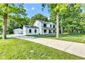 Beautiful two-story home with long driveway, garage, and lush greenery providing a private and picturesque setting at 5710 W 650 N, Thorntown, IN 46071