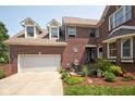 Lovely two-story brick home with a two car garage and well manicured landscaping at 6483 Royal Oakland Dr, Indianapolis, IN 46236