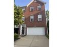 Charming brick home featuring a two-car garage and well-maintained landscaping at 6927 Havenmoor Pl, Indianapolis, IN 46250